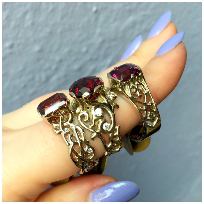 Three beautiful garnet rings made by Hunt Country Jewelers.