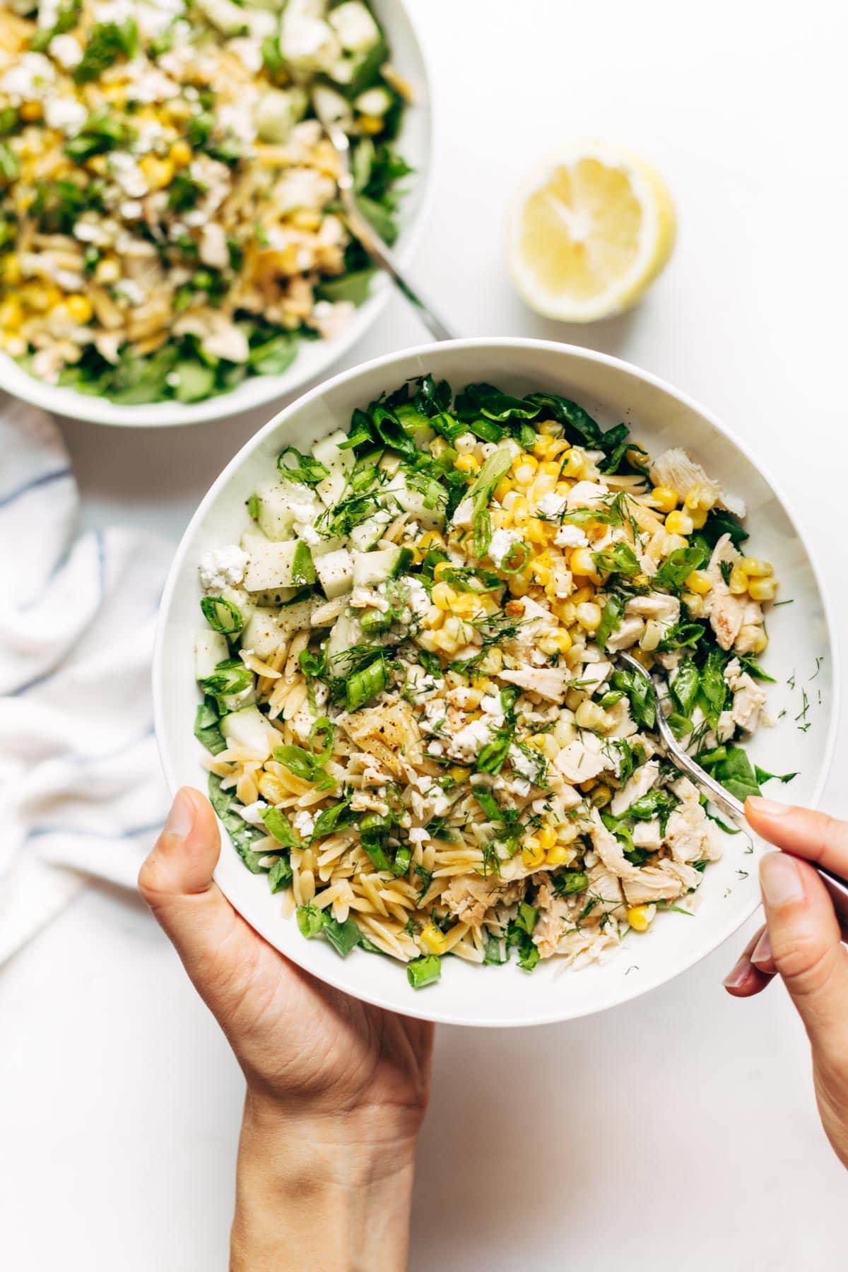 Orzo Summer Salad! With chicken and orzo, loaded with fresh veggies, and finished with a zippy lemon dressing and goat cheese. | pinchofyum.com