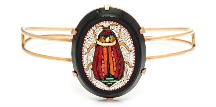 An antique Egyptian Revival bangle bracelet with a beautiful micromosaic scarab. In Leslie Hindman's upcoming September jewelry sale.