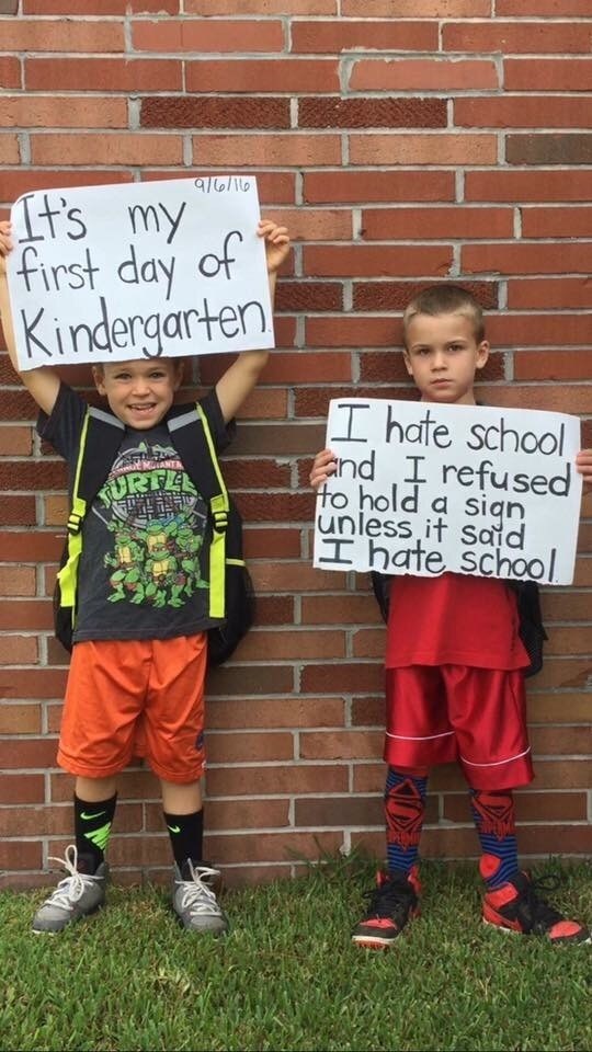 win image kids hold up brutally honest back to school sign