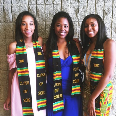 The author (middle) with her friends at her school's Black Graduation ceremony.