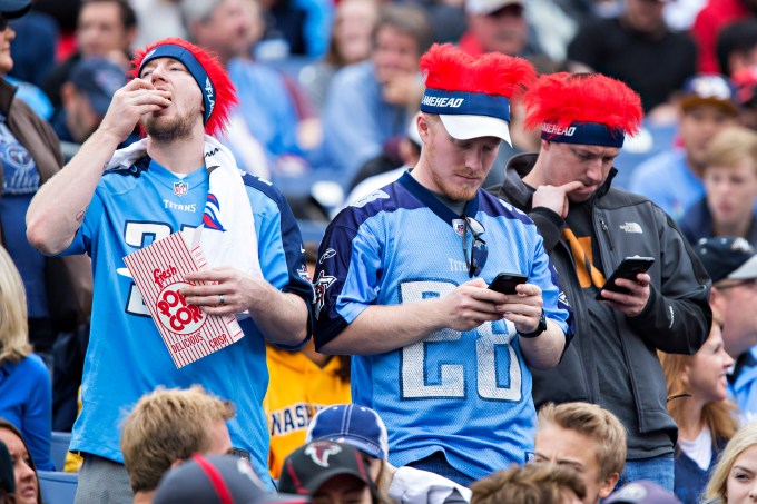 NASHVILLE, TN - OCTOBER 25: Fans of the Tennessee Titans in the stands with their cell phones during a game against the Atlanta Falcons at Nissan Stadium on October 25, 2015 in Nashville, Tennessee. The Falcons defeated the Titans 10-7. (Photo by Wesley Hitt/Getty Images)