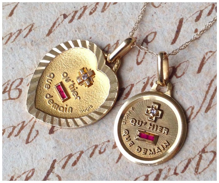 Two vintage French love charms - the Augis medaille d'amour available from Erin Antiques.