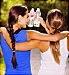 women hugging holding water bottles