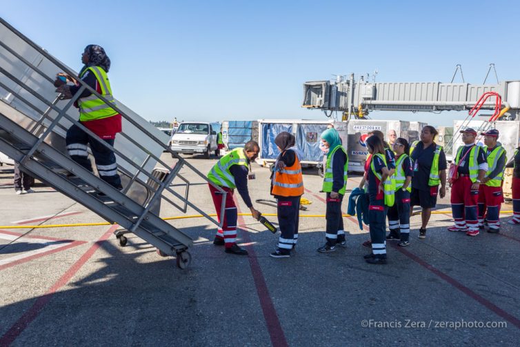 Cleaning staff are screened prior to boarding the plane.