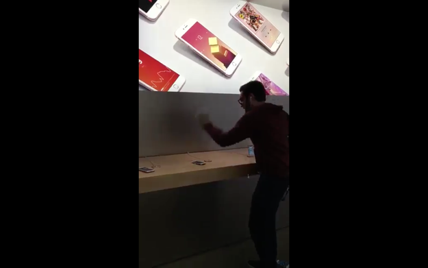 In a video filmed by a bystander, the man yells about his rights as a consumer had been violated by Apple.