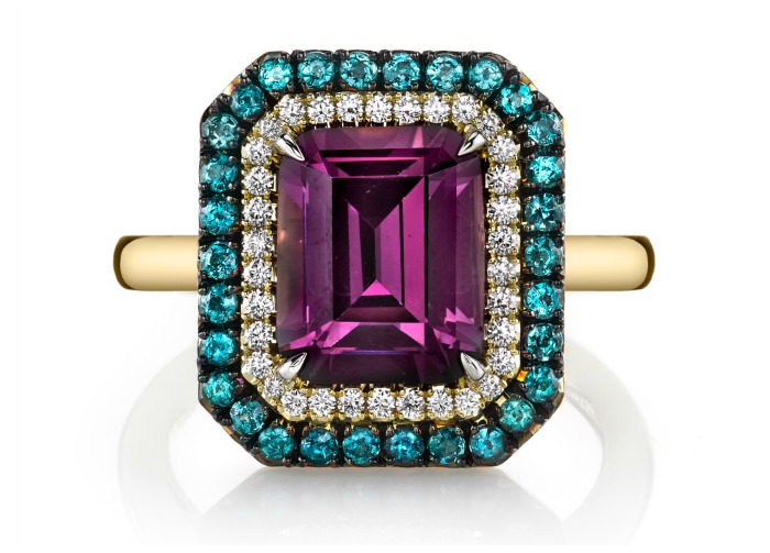 The Omi Prive Duet ring with a beautiful and rare 3.48 carat emerald cut purple spinel surrounded by diamonds and alexandrites.