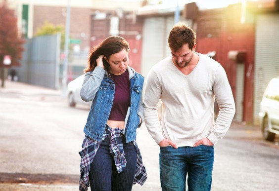 Young Serious Couple in Urban Setting