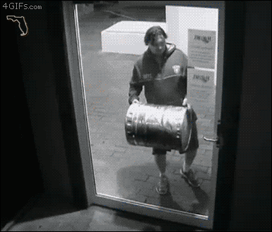 funny fail gif breaking through a glass door the hardest way possible