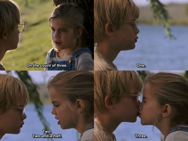 Macaulay Culkin and Anna Chlumsky kiss in MY GIRL (1991)