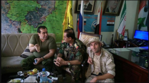 Photo 1. Aleppo operations room, posted by pro-regime account in late Oct. Iranian, Syrian, Russian, Lebanese Hezbollah flags in background.