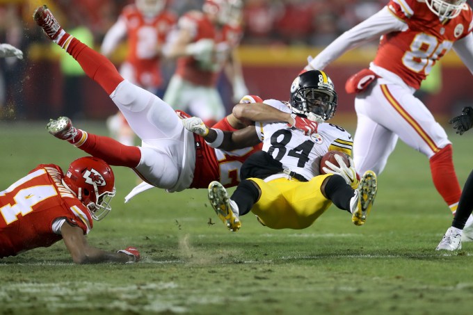 KANSAS CITY, MP - JANUARY 15: Wide receiver Antonio Brown #84 of the Pittsburgh Steelers is tackled by cornerback Marcus Peters #22 of the Kansas City Chiefs during the second half in the AFC Divisional Playoff game at Arrowhead Stadium on January 15, 2017 in Kansas City, Missouri. (Photo by Matthew Stockman/Getty Images)