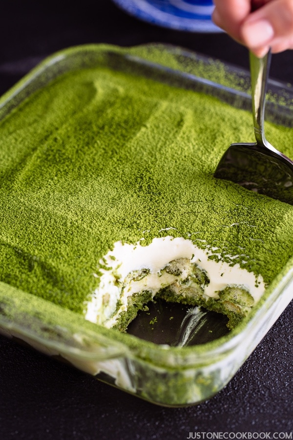 Matcha Tiramisu in a clear glass baking sheet, showing the beautiful layers of matcha tiramisu.