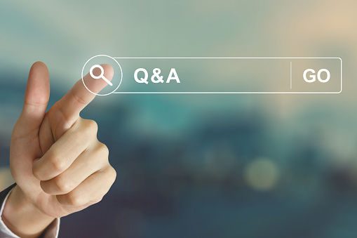 business hand clicking Q&A or Question and Answer button
