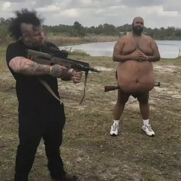 gif of man with gun in gut