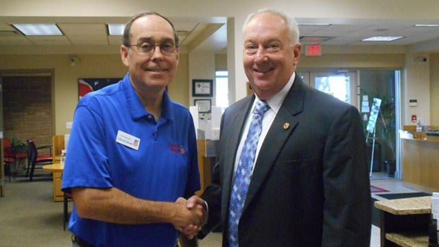 State Rep. Beiser, right, at Banker for a Day event in 2015. (Credit: Office of the Illinois State Representative District 111)