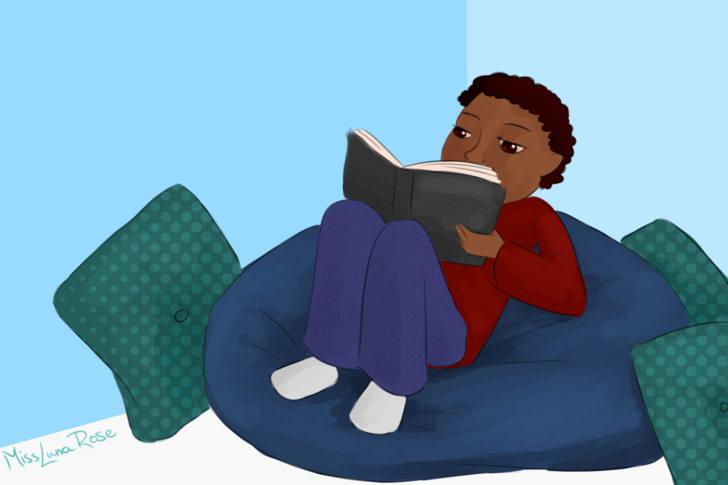 Guy Reads on Beanbag Chair.png