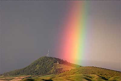 A rainbow touching down in the Palouse region of western Washington