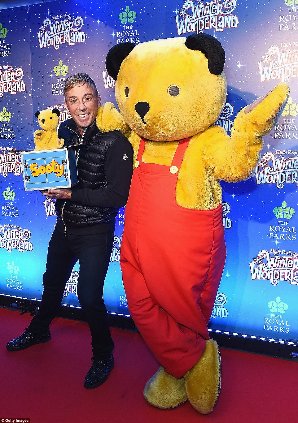 Grin and bear it: Richard Cadell  seemed chirpy as he joined Sooty at the event 
