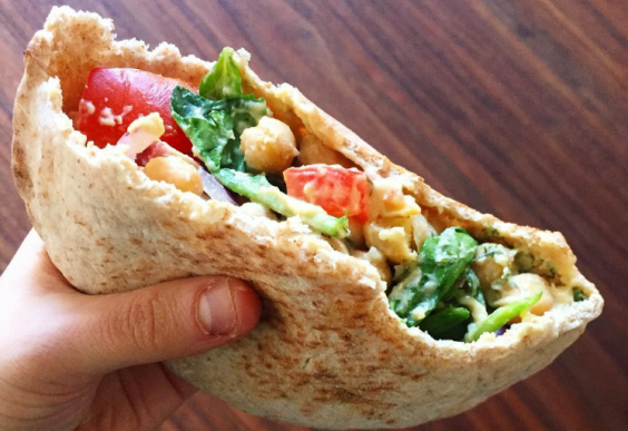 A pita pocket filled with healthy, tasty things.