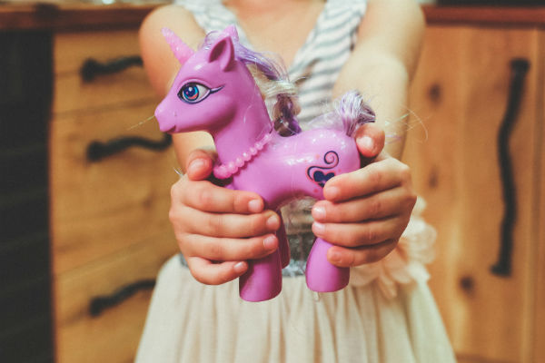 child unicorn hands holding