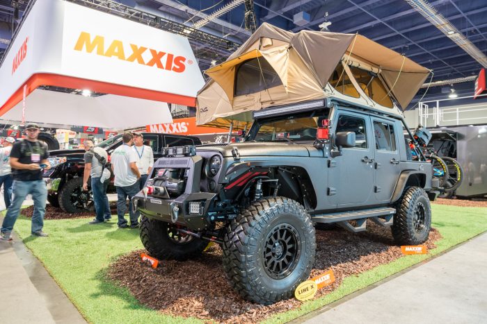 jeep wrangler with a rooftop tent at sema show