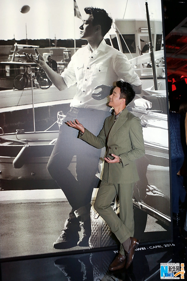 Chinese actor Tong Dawei watches fashion show in Milan