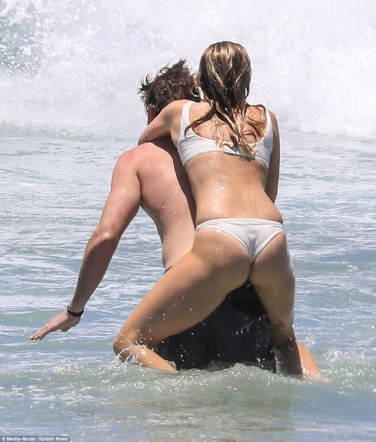 Miley Cyrus and Liam Hemsworth all loved up at the beach