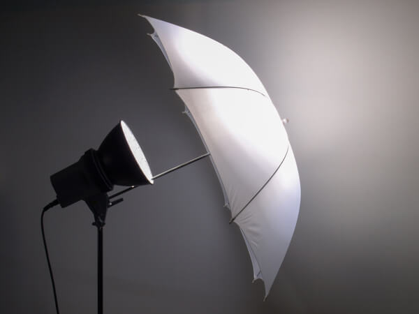 A photo umbrella helps create soft, flattering light for your videos.