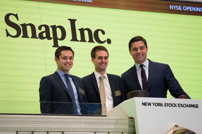 NEW YORK, NY - MARCH 2: (L to ) Snapchat co-founders Bobby Murphy, chief technology officer of Snap Inc., and Evan Spiegel, chief executive officer of Snap Inc., prepare to ring the opening bell as Thomas Farley, president of the NYSE, looks on, March 2, 2017 in New York City. Snap Inc. priced its initial public offering at $17 a share on Wednesday and Snap shares will start trading on the New York Stock Exchange (NYSE) on Thursday. (Photo by Drew Angerer/Getty Images)
