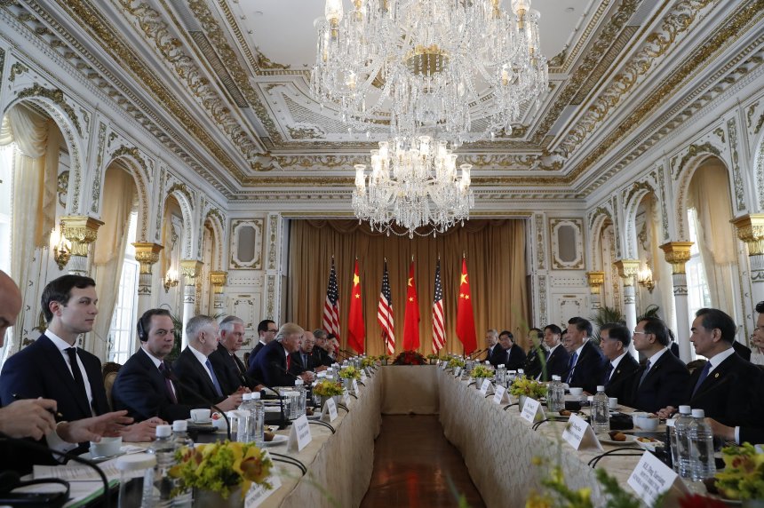 President Donald Trump, left, and Chinese President Xi Jinping, right, meet at Mar-a-Lago, Friday, April 7, 2017, in Palm Beach, Fla. Trump was meeting again with his Chinese counterpart Friday, with U.S. missile strikes on Syria adding weight to his threat to act unilaterally against the nuclear weapons program of China's ally, North Korea. (AP Photo/Alex Brandon)