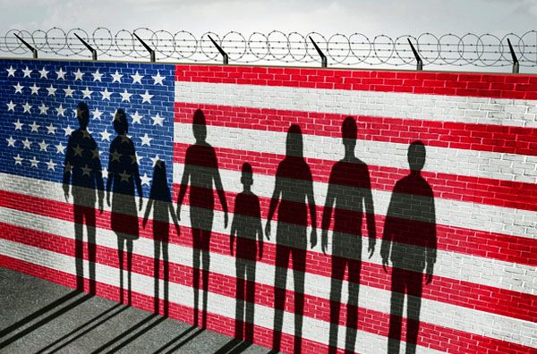 American immigration and United States refugee crisis concept as people on a border wall with a US flag as a social issue about refugees or illegal immigrants with the cast shadow of a group of migrating women men and children.