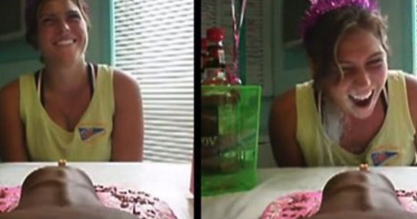 Video of girl getting surprise from funny adult-themed cake.