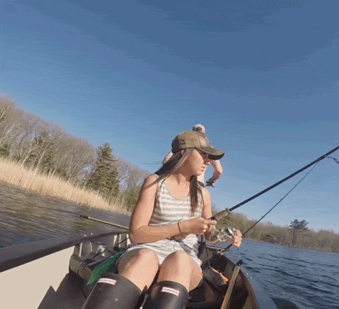 Gif of a guy casts his line while fishing and catches girlfriends hat