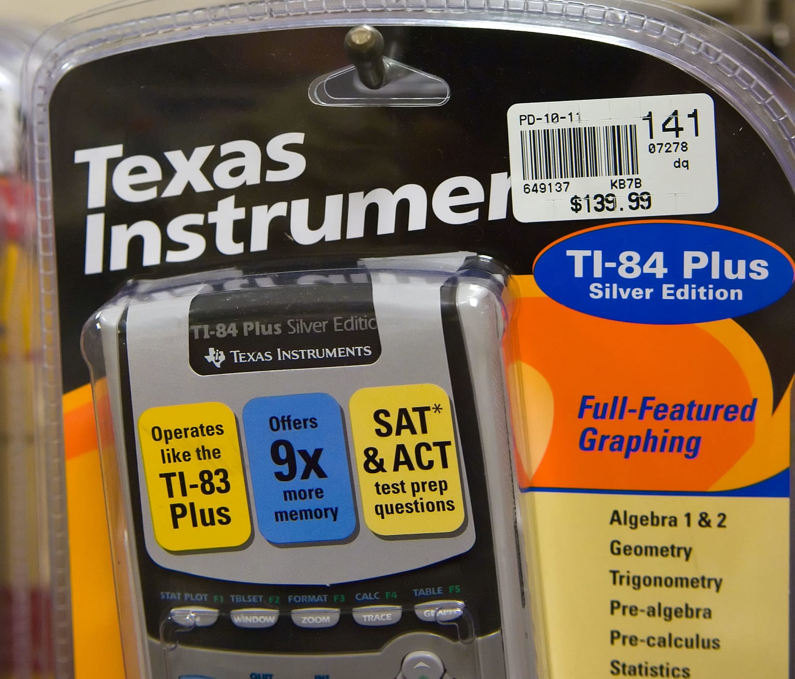 A Texas Instruments TI-84 calculator hangs on a display rack