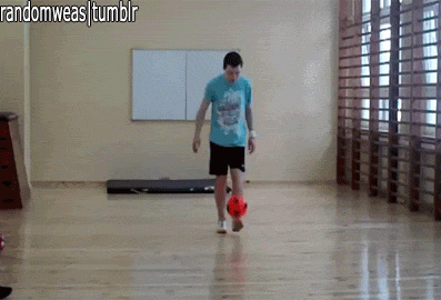 guy trips while doing a trick with a soccer ball