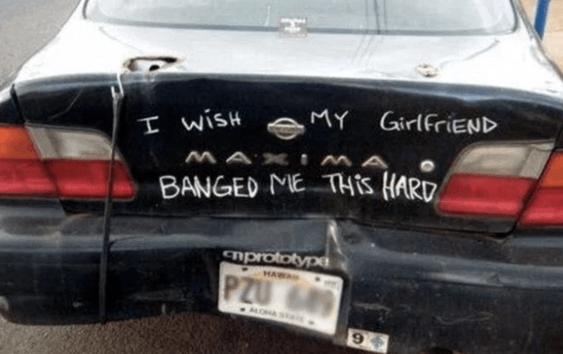 Picture of car's bumper sticker that is talking about guy's complaint with dating his girlfriend.