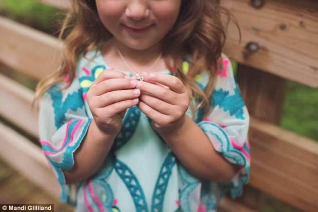 Grant presented the five-year-old with a heart necklace when he popped the question