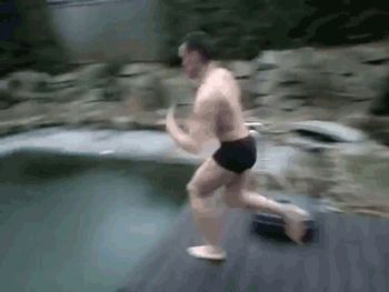 guy cannonballs into a frozen pool