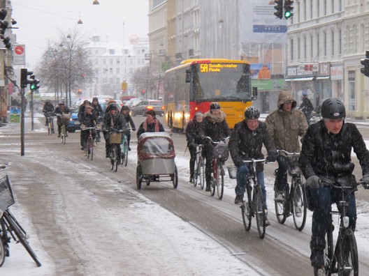 The cyclists commute to work in Copenhagen, snow or shine. Image © Kaitlin Johnson