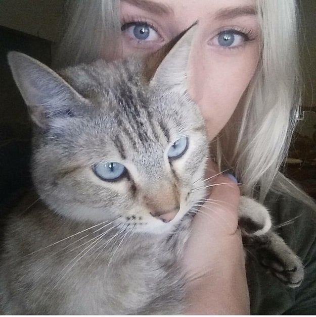 This is 19-year-old Cristi Hanzel from Littlerock, California. And that's her cat who she's named Wednesday — "after Wednesday Addams since they are both so sassy," she told BuzzFeed News.