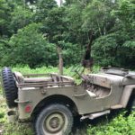 The jeep sits deep in the jungle near Munda, just in front of a Japanese anti-aircraft gun. (Photo credit: Rebecca Strauss)