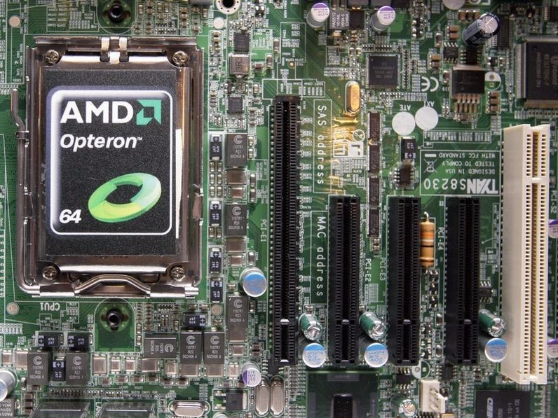 A new AMD Opteron 6000 series processor is seen on a motherboard during a product launch in Taipei April 14, 2010. REUTERS/Pichi Chuang 