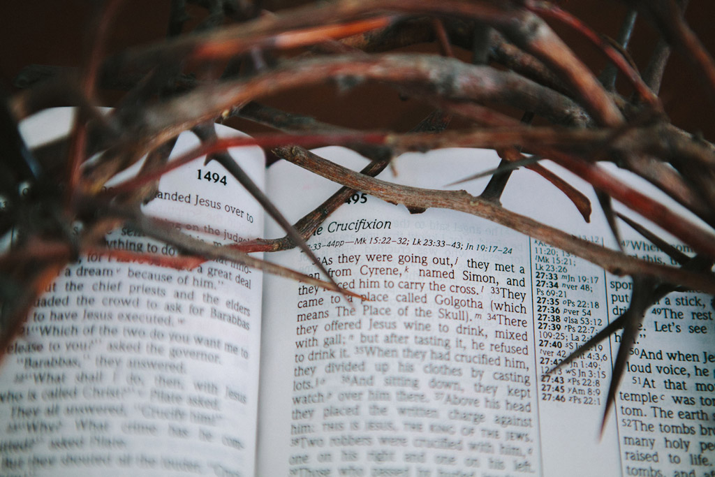 Crown of thorns on top of an open Bible