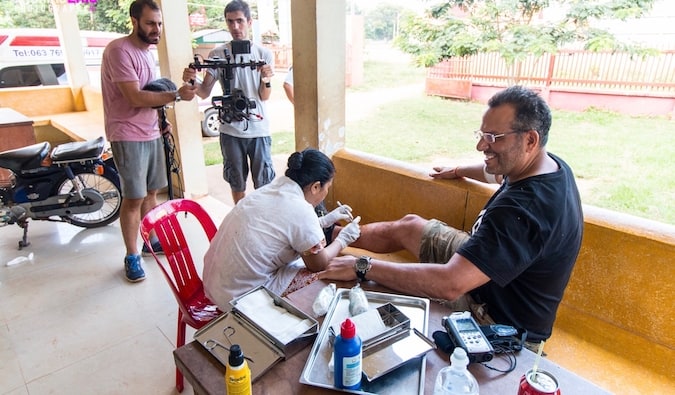 Ric from Global Gaz getting injuredin rural Cambodia getting stiches from rally accident
