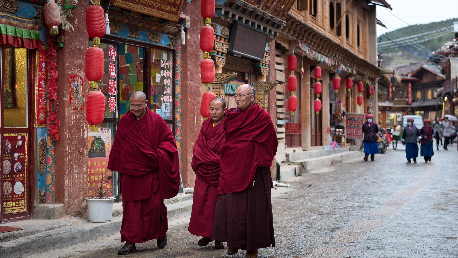 Tibetan monks stroll through the streets of old town in Shangri-La.