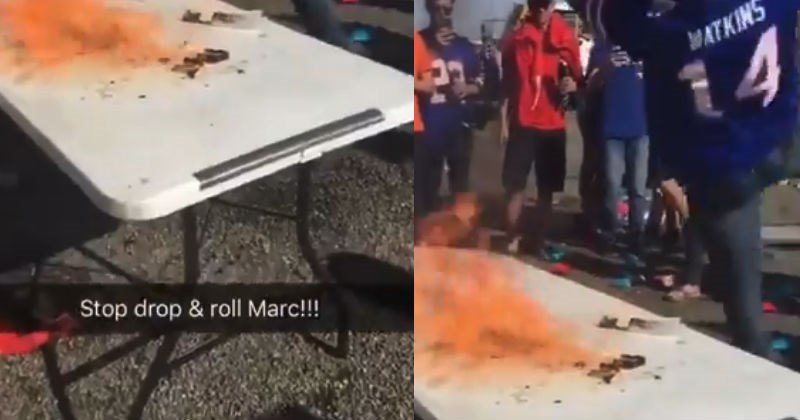 Bills football fan sets himself on fire by jumping on lit table.