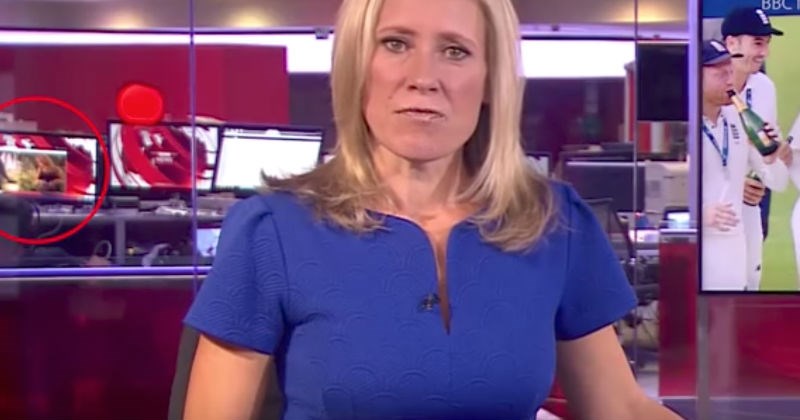 BBC news anchor with embarrassing screen live in the background.