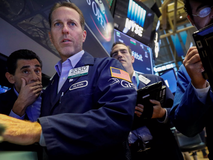 Traders work on the floor of the New York Stock Exchange (NYSE) in New York, U.S., August 25, 2017. REUTERS/Brendan McDermid