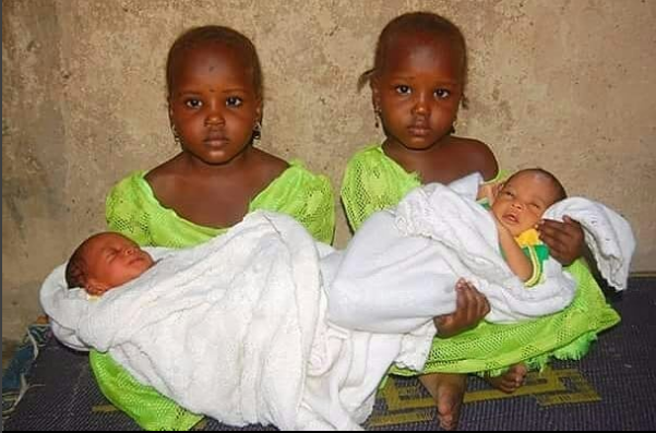 Adorable !Twin sisters carry their newborn twin brothers